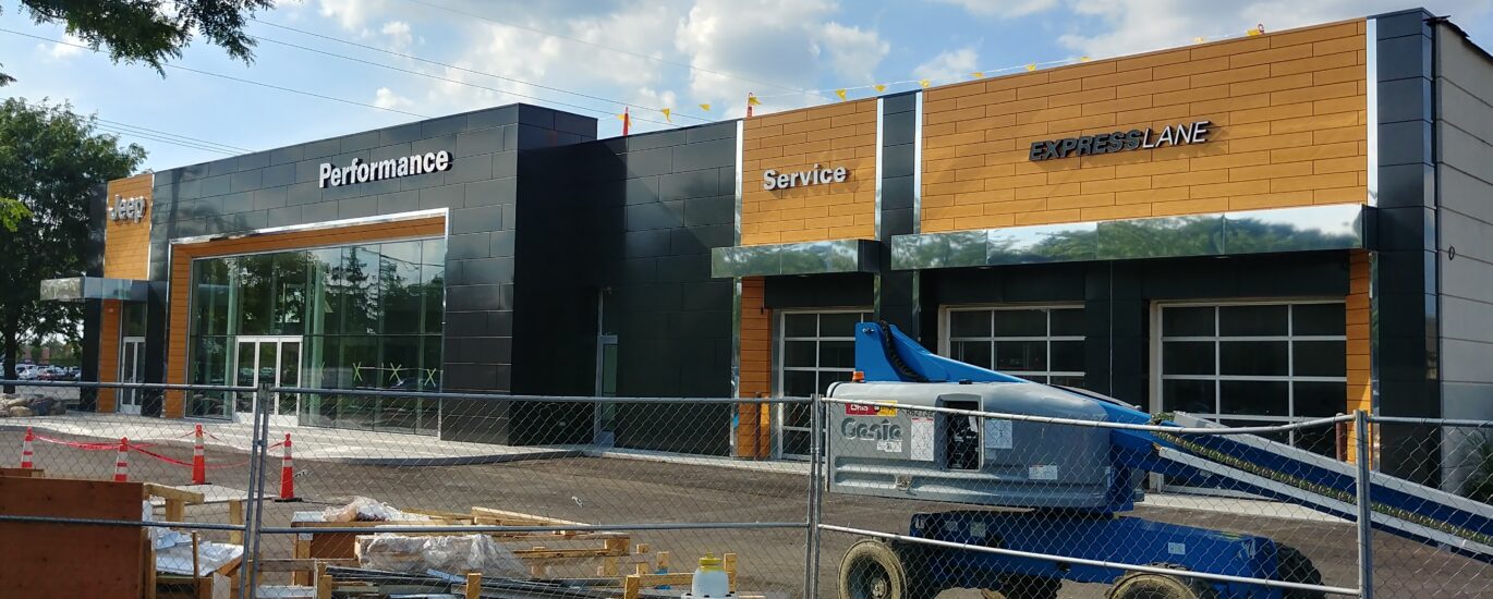 Commercial metal fabrication panels and architectural cladding installed on a modern building by Global Fabrication