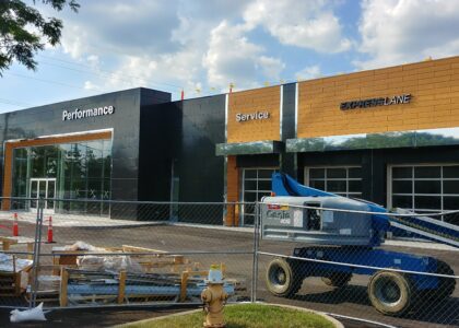 Commercial metal fabrication panels and architectural cladding installed on a modern building by Global Fabrication